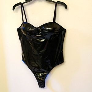 Bodysuit faux patent leather. New with Tags.